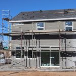 Scaffolding surrounds a new home under construction in Elk Grove, California.