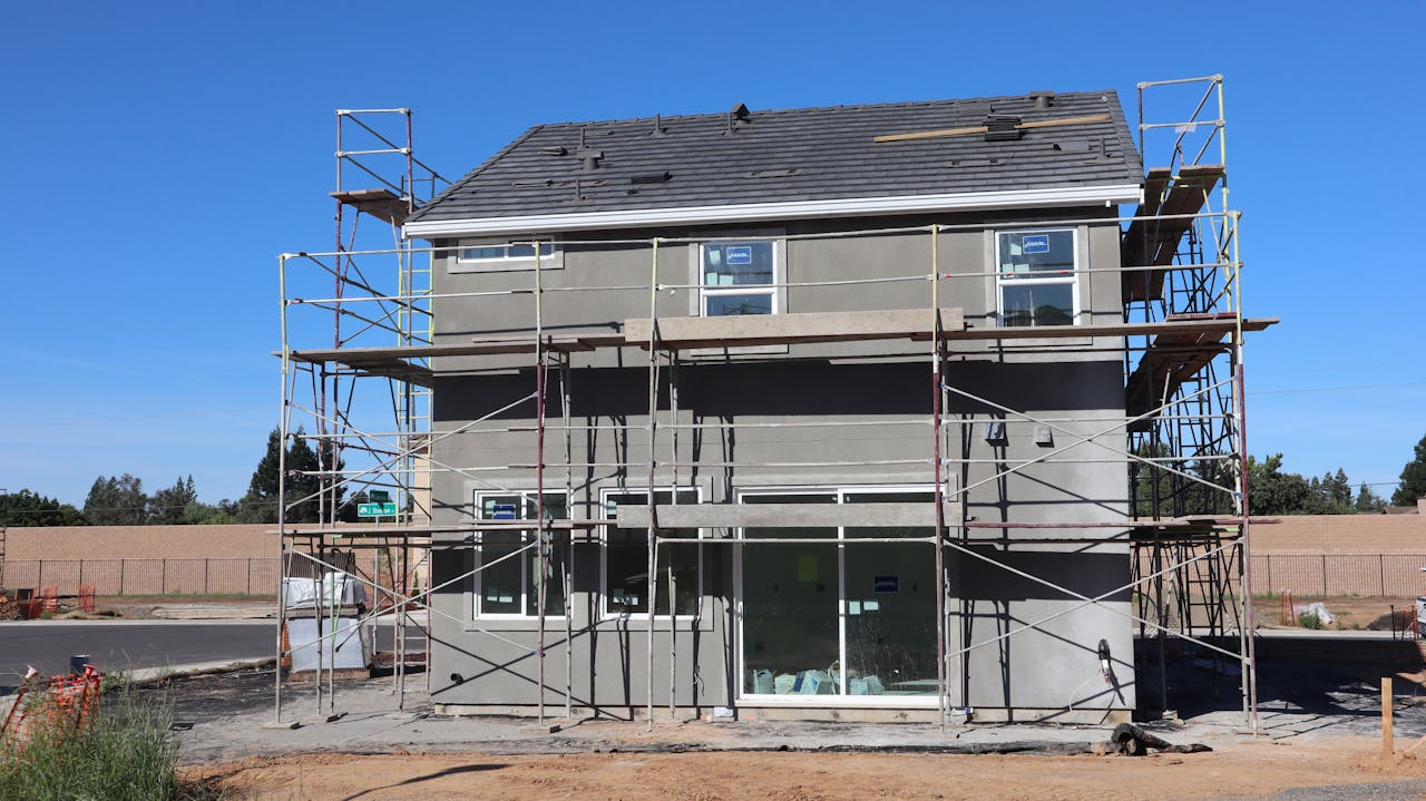Scaffolding surrounds a new home under construction in Elk Grove, California.